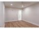 Neutral bedroom with hardwood floors and ensuite bathroom at 1705 Lord Ashley Dr, Sanford, NC 27330