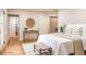 Bright bedroom with hardwood floors, natural light, and access to walk-in closet at 1705 Lord Ashley Dr, Sanford, NC 27330