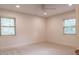 Bright bedroom with large windows and neutral carpeting at 1705 Lord Ashley Dr, Sanford, NC 27330