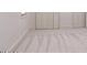 Bedroom features neutral carpeting and light-filled space at 1705 Lord Ashley Dr, Sanford, NC 27330