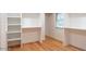 Bright closet with built-in shelving and wood flooring at 1705 Lord Ashley Dr, Sanford, NC 27330