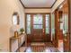 Welcoming foyer with brick flooring and a decorative wooden front door at 1705 Lord Ashley Dr, Sanford, NC 27330