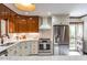 Bright kitchen features white cabinets, granite countertops, and stainless steel appliances at 1705 Lord Ashley Dr, Sanford, NC 27330