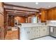 Kitchen with custom cabinets, stainless steel appliances, marble countertops, and tile flooring at 1705 Lord Ashley Dr, Sanford, NC 27330