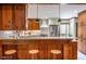 Updated kitchen with wood accents, a breakfast bar, and modern appliances at 1705 Lord Ashley Dr, Sanford, NC 27330