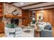 Inviting living room with wood accents, a brick fireplace, and comfortable seating at 1705 Lord Ashley Dr, Sanford, NC 27330