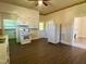 Kitchen featuring white cabinets, wood floors, a new stove, and a refrigerator at 1716 Turner St, Roxboro, NC 27573