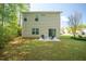The rear of this two-story home has a small patio and yard at 1817 Heisser Ln, Fuquay Varina, NC 27526