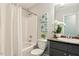 Bright bathroom featuring a tub and shower combo and a granite countertop vanity at 1817 Heisser Ln, Fuquay Varina, NC 27526