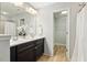 Modern bathroom with double vanity, and a walk-in closet at 1817 Heisser Ln, Fuquay Varina, NC 27526