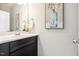 Half bathroom features dark vanity cabinet, white countertop, and modern finishes at 1817 Heisser Ln, Fuquay Varina, NC 27526