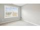 Bright bedroom with neutral carpet featuring natural light through a large window at 1817 Heisser Ln, Fuquay Varina, NC 27526