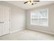 This bedroom features neutral paint, plush carpet, and bright natural light at 1817 Heisser Ln, Fuquay Varina, NC 27526