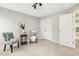 Bright bedroom with neutral carpet featuring natural light, a closet, and seating at 1817 Heisser Ln, Fuquay Varina, NC 27526
