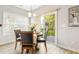 Dining area features wood table, seating for four, and a window with natural light at 1817 Heisser Ln, Fuquay Varina, NC 27526