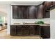 Spacious kitchen features laminate counters and dark cabinets with modern finishes at 1817 Heisser Ln, Fuquay Varina, NC 27526