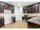 Kitchen boasts stainless steel appliances, dark cabinets, and laminate countertops at 1817 Heisser Ln, Fuquay Varina, NC 27526