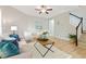 Comfortable living room with a plush sofa, accent chairs, and bright natural lighting at 1817 Heisser Ln, Fuquay Varina, NC 27526