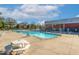 Community swimming pool with multiple lanes and lounge chairs under a sunny sky at 1817 Heisser Ln, Fuquay Varina, NC 27526