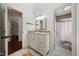 Bathroom featuring a granite countertop vanity, a framed mirror, and access to a shower and other rooms at 19 Lansgate Ct, Durham, NC 27713