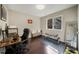 Bedroom/office space featuring a desk, chair, workout area, and natural light from a large window at 19 Lansgate Ct, Durham, NC 27713