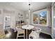 Cozy breakfast nook with a bistro table, modern chairs, and a large window providing natural light and views at 19 Lansgate Ct, Durham, NC 27713