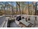 Relaxing deck space with outdoor furniture, perfect for enjoying nature views and grilling at 19 Lansgate Ct, Durham, NC 27713
