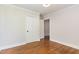 Cozy bedroom featuring hardwood floors, closet, and white trim at 206 Bickett Blvd, Raleigh, NC 27608