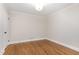 Bedroom featuring hardwood floors and white trim at 206 Bickett Blvd, Raleigh, NC 27608