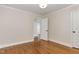 Bright bedroom featuring hardwood floors and white trim at 206 Bickett Blvd, Raleigh, NC 27608