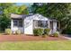 Charming home showcasing a well-maintained lawn and freshly mulched landscaping at 206 Bickett Blvd, Raleigh, NC 27608