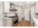 Modern kitchen featuring stainless steel appliances, granite countertops, and ample storage in an updated space at 206 Bickett Blvd, Raleigh, NC 27608