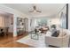 Inviting living room with hardwood floors, open layout, and a cozy seating area by the window at 206 Bickett Blvd, Raleigh, NC 27608