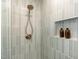 Sleek shower with custom tilework, a rainfall showerhead, and built-in niche at 206 Bickett Blvd, Raleigh, NC 27608