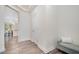 Hallway featuring modern flooring and a glimpse into a kitchen with a dining area at 210 Silas St, Durham, NC 27705