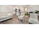 Open concept living area with a modern kitchen, comfortable seating, and a dining area, perfect for entertaining at 210 Silas St, Durham, NC 27705