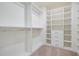 Spacious walk-in closet featuring custom shelving, drawers, and ample storage space at 210 Silas St, Durham, NC 27705