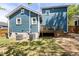 Exterior view of a two-story home showcasing its backyard with a wooden deck at 211 Hargrove St St, Durham, NC 27701