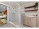 Modern bathroom features a glass shower, floating shelves, and decorative accents at 211 Hargrove St St, Durham, NC 27701
