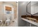 Bathroom featuring a modern vanity, tiled floors, and a shower with unique tiling at 211 Hargrove St St, Durham, NC 27701