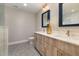 Bathroom features a double vanity with decorative mirrors and a decorative vase with flowers at 211 Hargrove St St, Durham, NC 27701