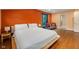 Cozy bedroom with hardwood floors and soft natural light, featuring a comfy queen-size bed at 211 Hargrove St St, Durham, NC 27701