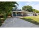 Charming blue home with a large driveway leading to a welcoming covered front porch at 211 Hargrove St St, Durham, NC 27701