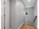 Upstairs hallway features natural light and freshly painted neutral walls at 211 Hargrove St St, Durham, NC 27701