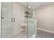 Modern glass shower with built-in seat and shelving features subway tile and hexagon tile floor at 211 Hargrove St St, Durham, NC 27701