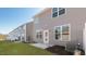 New home backyard features a concrete patio and newly installed turf at 2322 Sugar Cone Way, Fuquay Varina, NC 27526