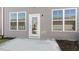 Backyard with concrete patio, exterior light and lush lawn at 2322 Sugar Cone Way, Fuquay Varina, NC 27526