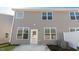 Backyard with a concrete patio and grey siding at 2322 Sugar Cone Way, Fuquay Varina, NC 27526