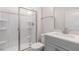 Modern bathroom with a glass shower, a white vanity, and sleek fixtures at 2322 Sugar Cone Way, Fuquay Varina, NC 27526