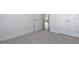 Bedroom with plush carpeting, closet, and open entry at 2322 Sugar Cone Way, Fuquay Varina, NC 27526